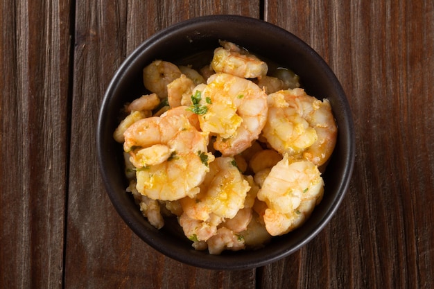 Portion of shrimp moqueca in bowl top view