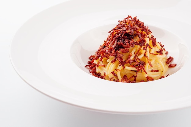 Portion of spaghetti with fried bacon