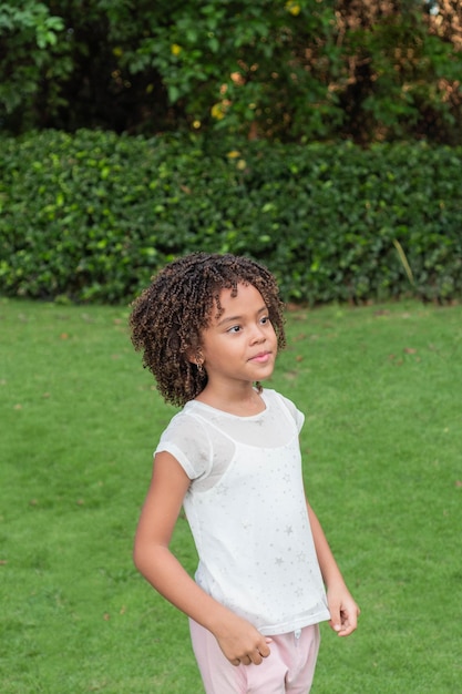 Portrait of 7 years old girl standing outdoors