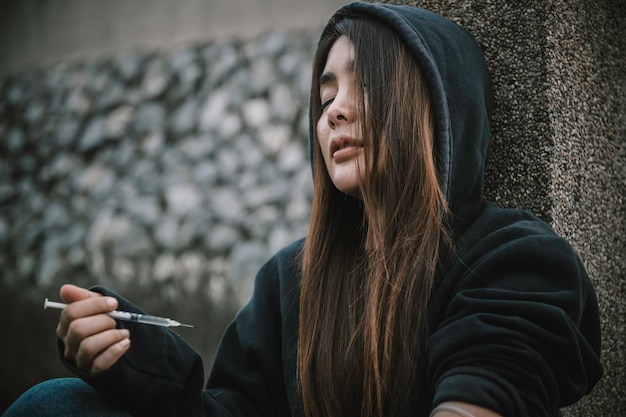 Photo portrait of addict drug asian woman