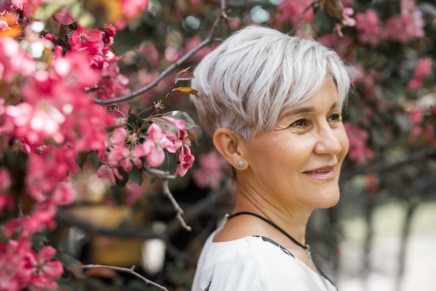 portrait of an adult beautiful woman in flowering trees