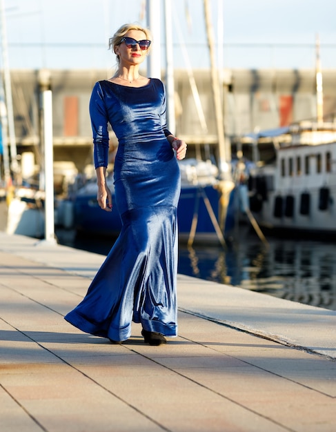 Portrait of adult fashionable elegant woman in the port