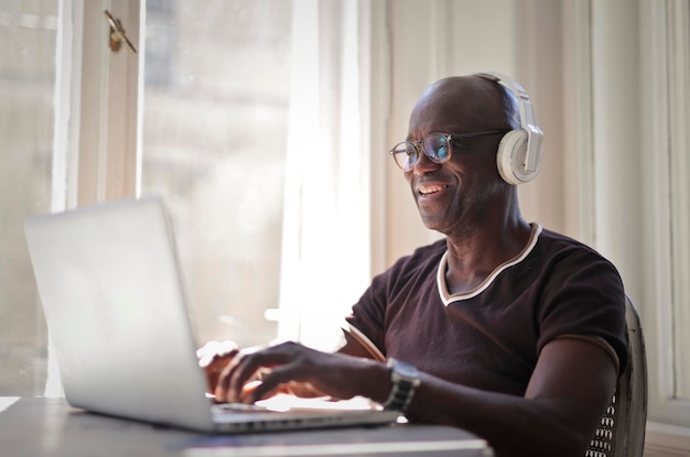 portrait of adult man while working with a computer