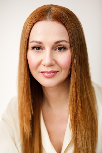 Portrait of an adult woman woman looks at the camera and smiles