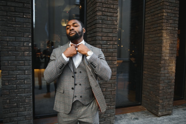 Portrait of an african-american businessman wearing a suit standing outdoors