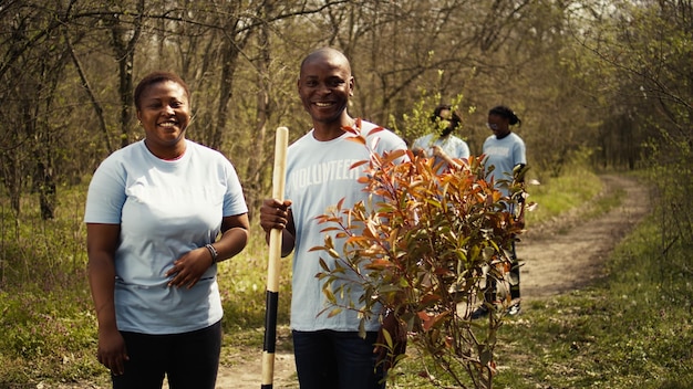 Portrait of african american couple fighting to preserve natural environment