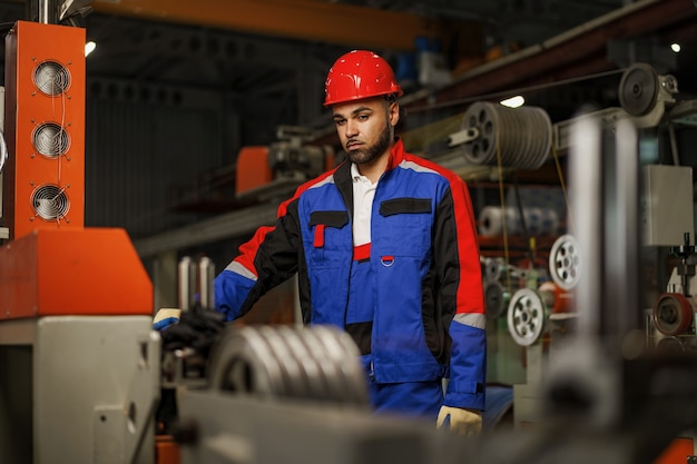 Portrait of african american male handyman working in an industrial factory