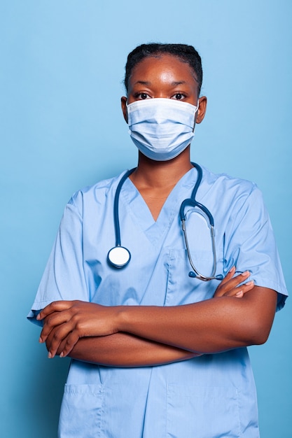 Portrait of african american physician assistant with protective face mask