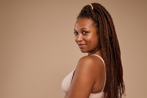 Portrait of African young girl with beautiful hairstyle  isolated on white background