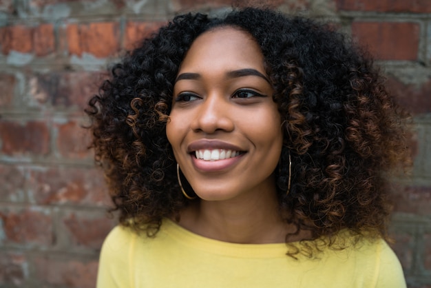 Portrait of Afro-american woman in the street.