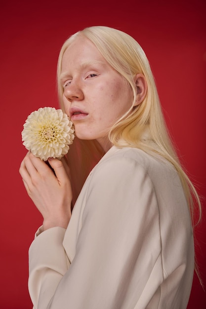 Portrait of albino girl with flower