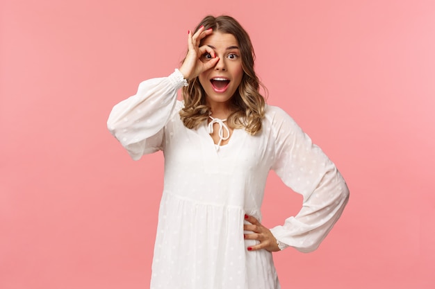 Portrait of amazed and fascinated, surprised young blond girl seeing something really cool