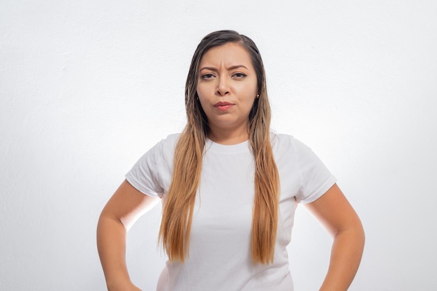 Portrait of angry person Portrait of mexican woman isolated on white background showing anger