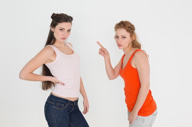 Portrait of angry young female friends having an argument