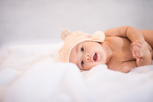 Portrait asia baby on white bed