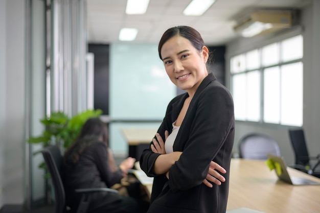 Portrait of Asian business woman is smiling in office