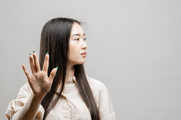 Portrait of a asian girl on a light background