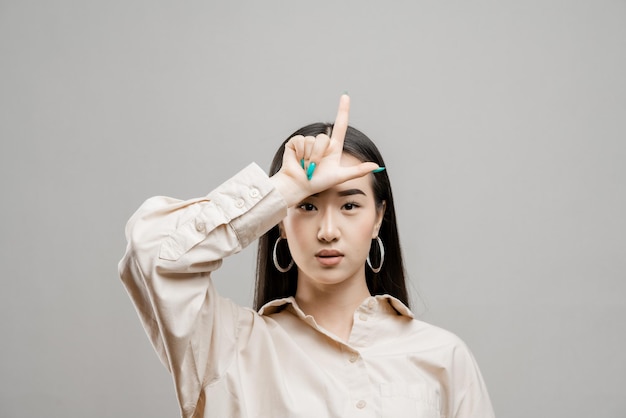 Portrait of a asian girl on a light background