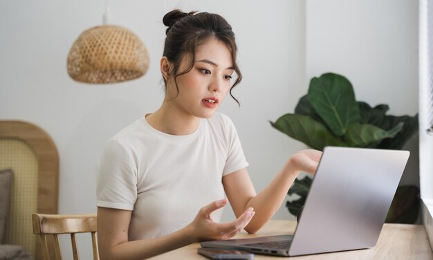 Portrait of asian girl working at home