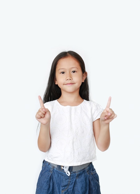 Portrait of Asian little child girl raised two forefinger to cheer isolated