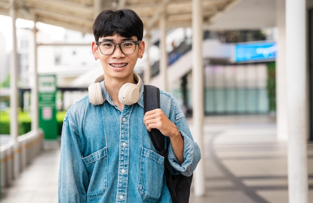 Portrait of Asian male student having fun at school