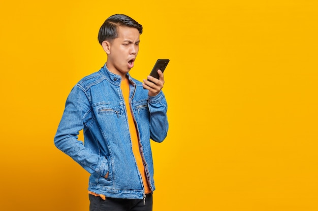 Portrait of asian man angry when talk at smartphone