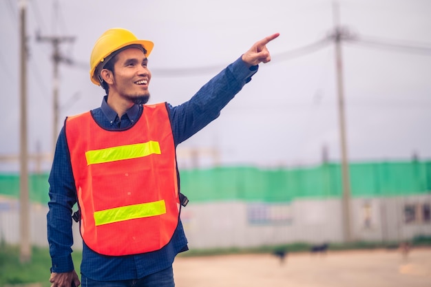 Portrait of Asian man engineer construction concept Asian man engineer in construction site Worker in building construction site worker helmet confident copy spec worker in safety suit at work