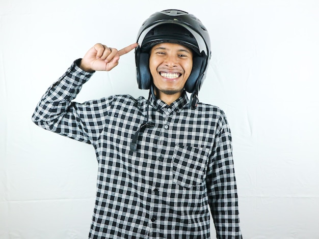 Portrait Asian man holding motorcycle helmet with excited expression Safety riding