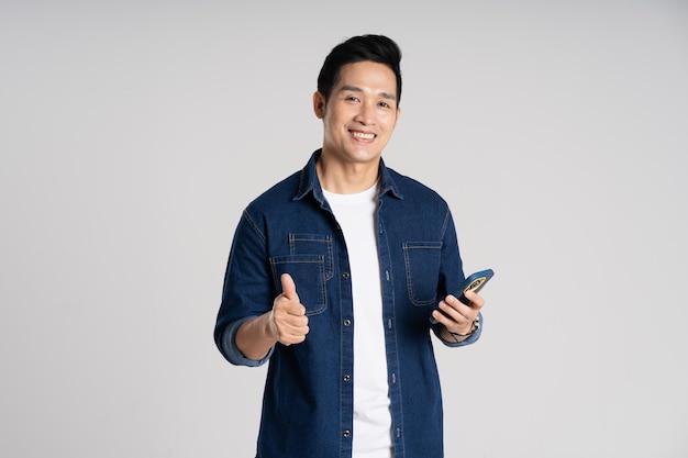 Portrait of Asian man posing on white background