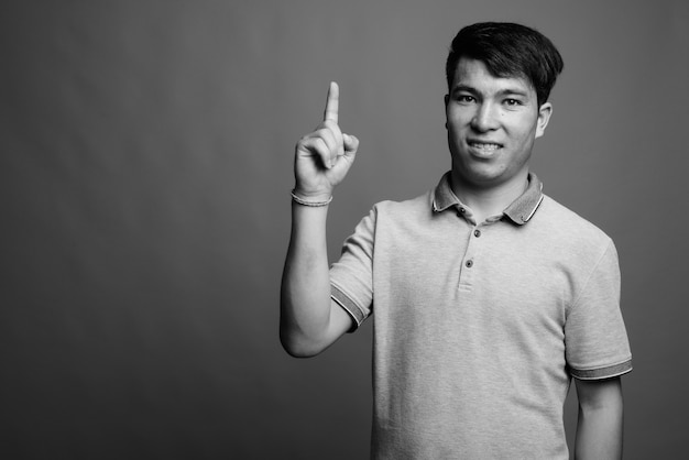 Portrait of Asian man wearing tshirt isolated