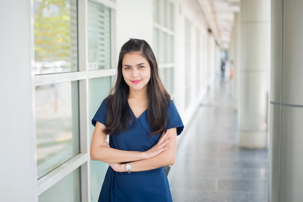 A portrait of an Asian university student on campus