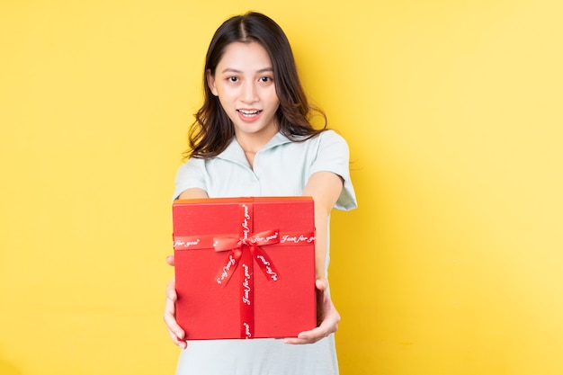 Portrait of asian woman holding gift box