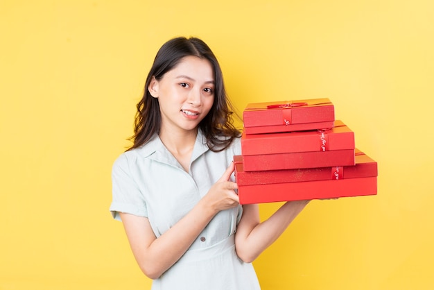 Portrait of asian woman holding gift box