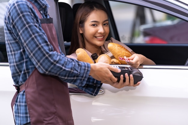 Portrait of asian woman make mobile payment contactless technology