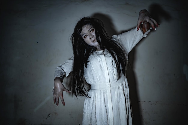 Portrait of asian woman make up ghostScary horror scene for backgroundHalloween festival conceptGhost movies poster