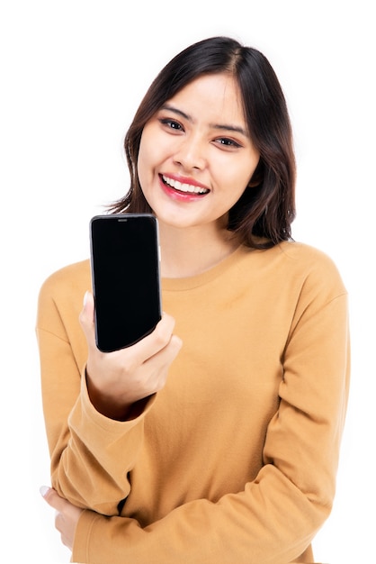 Portrait of Asian woman showing or presenting mobile phone application on hand over white background, Beautiful woman looking healthy, confident isolated on white.