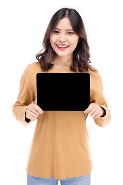 Portrait of Asian woman showing or presenting tablet computer on hand over white background, Beautiful woman looking healthy, confident isolated on white.