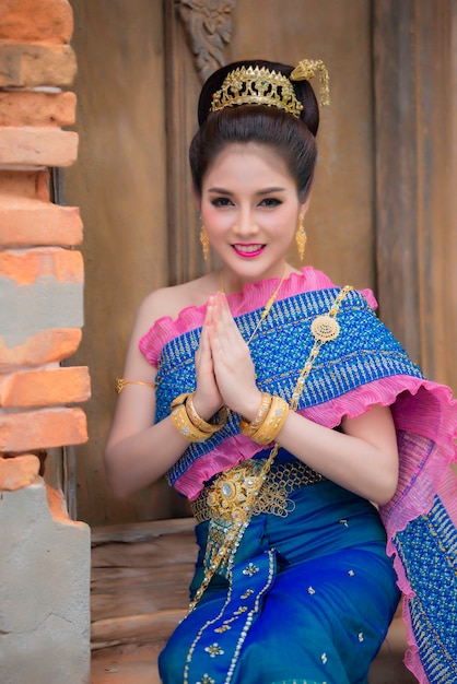 Portrait of asian woman wear ancient thai dress styleThailand people Thai traditional dress pay respect