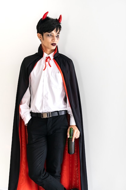 Portrait of Asian young adult teenage man wearing Halloween costume cloth