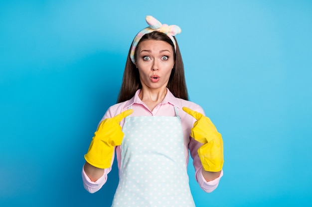 Photo portrait of astonished girl point index finger latex gloves herself impressed