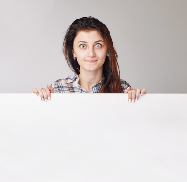 Portrait of an astonished young woman