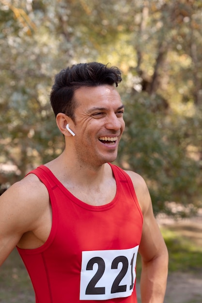 Portrait of athletic man participating in a cross country