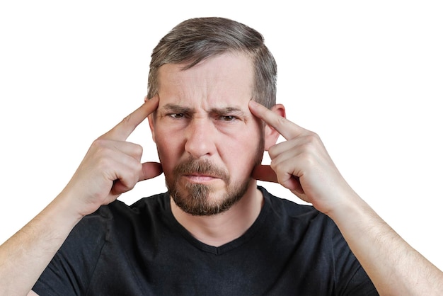 Portrait of an attractive bearded man of European appearance with a slight gray hair on an isolated white background He put his fingers to his temples Expression of emotions of a man