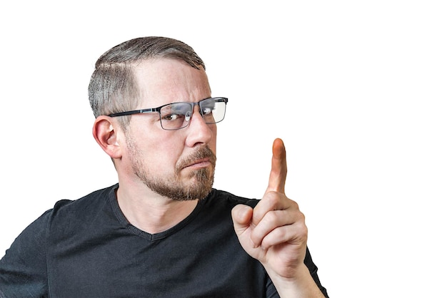 Portrait of an attractive bearded man of European appearance with a slight gray hair on an isolated white background He raised his index finger Expression of emotions of a man