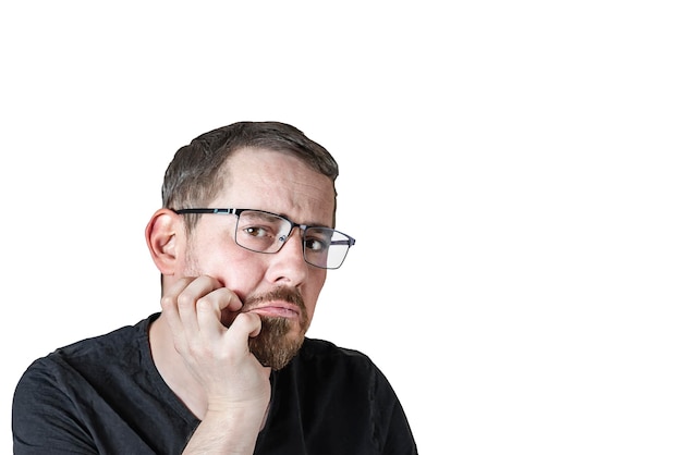 Portrait of an attractive bearded man of European appearance with a slight gray hair on an isolated white background Thoughtful facial expression Expression of emotions of a man