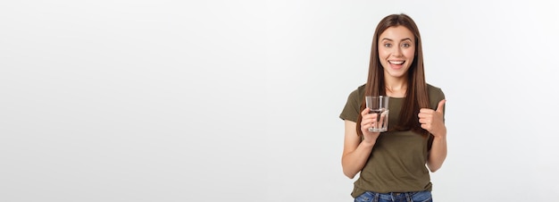 Portrait of attractive caucasian smiling woman isolated on white studio shot drinking water