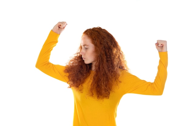 Portrait of attractive cheerful lucky redhaired girl rejoicing having fun