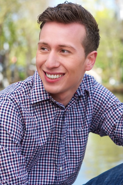 Portrait of an attractive man smiling outdoors