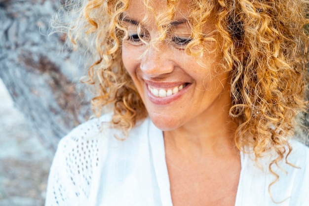 Photo portrait of an attractive wealthy woman enjoying her leisure time outdoors smiling with happiness and confidence captures the essence of a mindful lifestyle elegant and serene in her middleaged grace