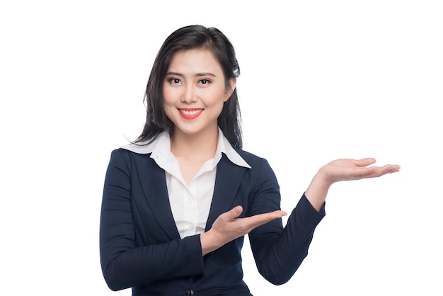 Portrait of an attractive young businesswoman showing by hands isolated on white